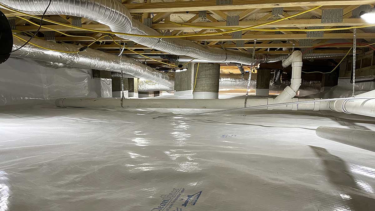 Crawl space encapsulation with sealed vapor barrier and dehumidifier in Austin home